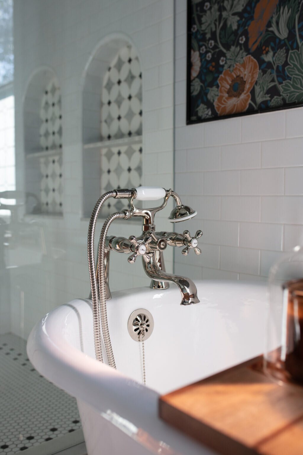Polished nickel tub filler with porcelain handles at the clawfoot tub in the Heights Primary Bath project by Jennifer Kizzee Design