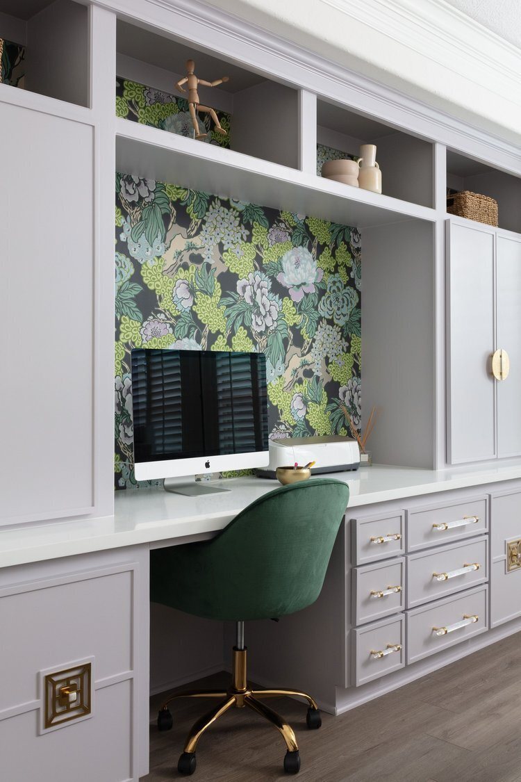 Craft room with lilac built-in desks against a green floral wall in the Pine Lodge project by Jennifer Kizzee Design