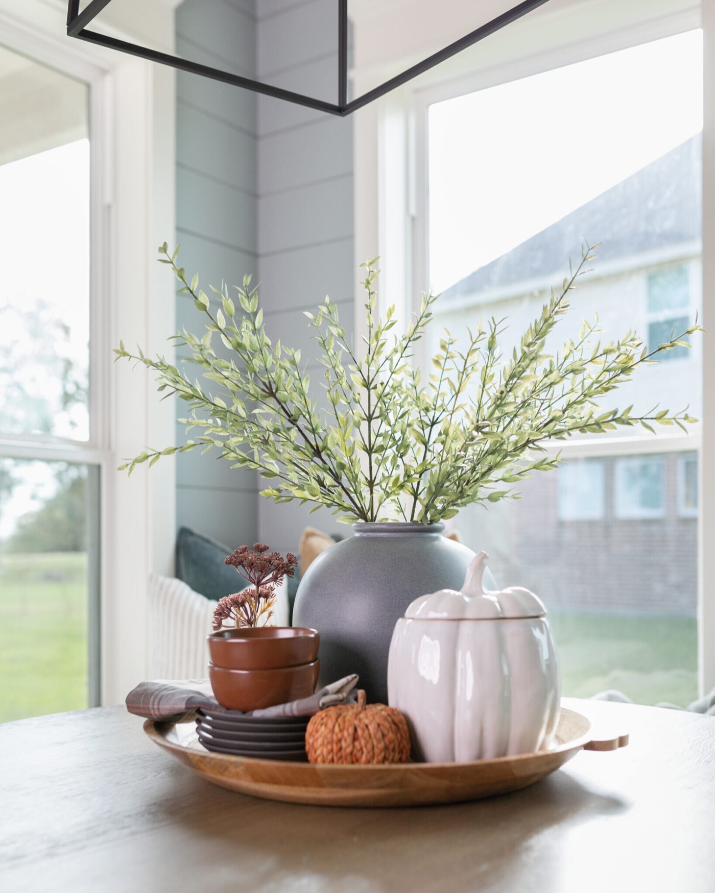 Wood dough bowl styled with a gray ceramic vase and white and terracotta pumpkins in the Silver Moon project by Jennifer Kizzee Design